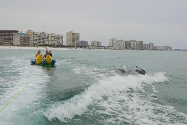 a man riding a wave on top of a body of water