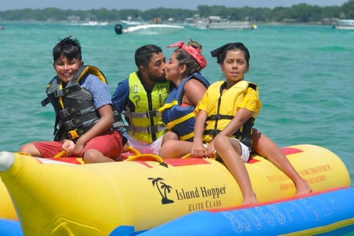 a group of people on a raft in a body of water