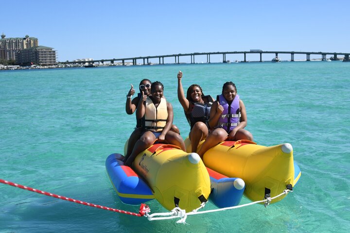 a person riding on the back of a boat in the water