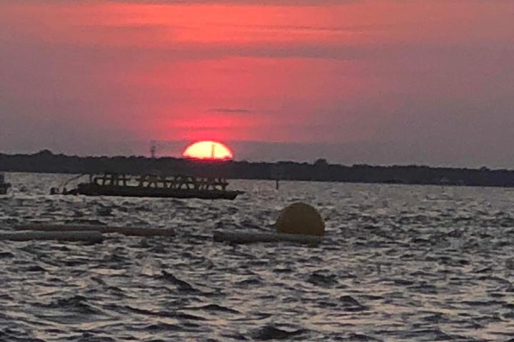 a sunset over a body of water