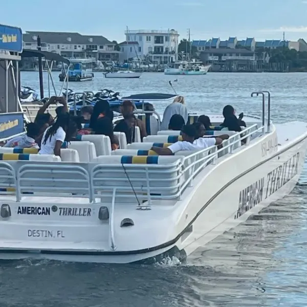 a group of people on a boat in the water